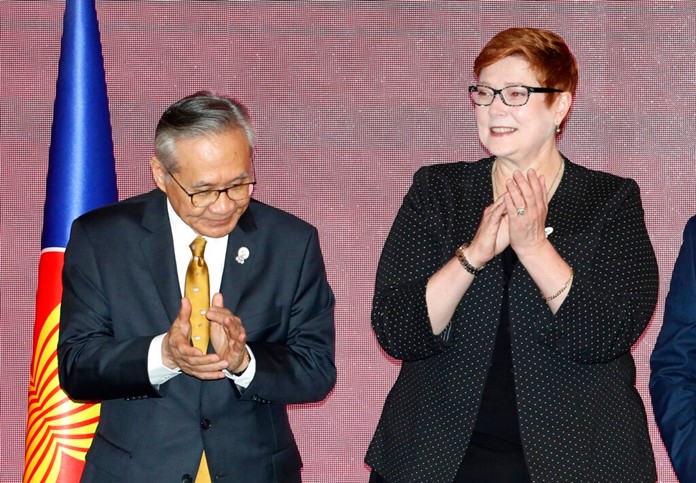 Thailand's Foreign Minister Don Pramudwinai, left, stands next to Australia's Foreign Minister Marise Payne during a group photo for ministers of the Association of Southeast Asian Nations (ASEAN) and Australia in Bangkok, Thursday, Aug. 1. (AP Photo/Sakchai Lalit)