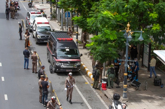 Investigators cordon-off an area in which an explosion injured people in Bangkok, Friday, Aug. 2, 2019. (AP Photo/Gemunu Amarasinghe)