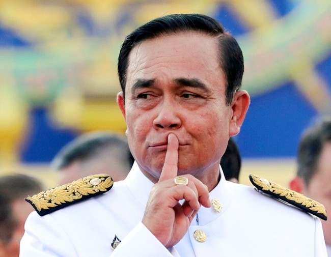 Thailand's Prime Minister Prayuth Chan-ocha gestures after a group photo with his Cabinet members at the government house in Bangkok July 16, 2019. (AP Photo/Sakchai Lalit, File)