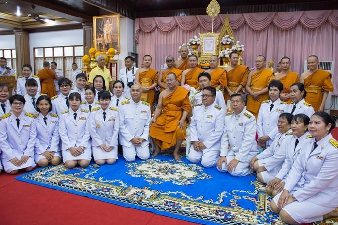 Abbot Anan Thamachoto (seated center) is surrounded by monks and government officials during the ceremony to celebrate his elevation to the monastic rank of Phraratchakhana Chan Raj at Chaimongkol Temple in Pattaya, July 29.