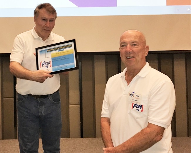 MC Roy Albiston (right) presents speaker LL with the PCEC’s Certificate of Appreciation for his presentation about the USA Lunar landing in 1969.