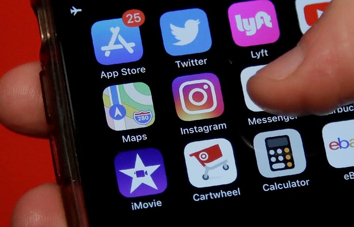 Instagram is expanding a test to hide how many “likes” people’s posts receive on its photo-sharing app. (AP Photo/Jeff Chiu)