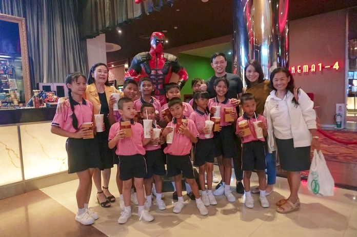 Orphans, migrant children and at-risk youths were treated to a day at the movies.