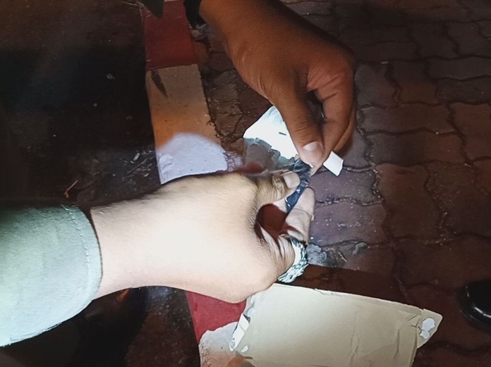 Police officers found and collected numerous 39mm gun cartridges and a tissue box with crystal methamphetamine, or ice, contained inside.