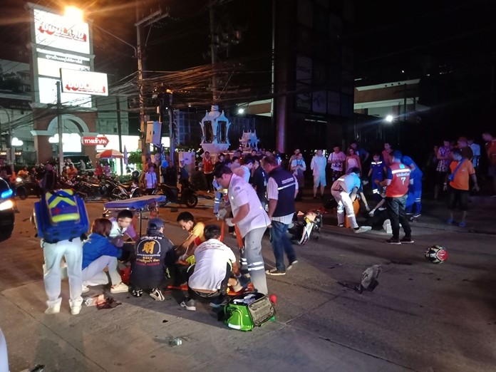 Rescue workers tend to the carnage on Pattaya Center Road.