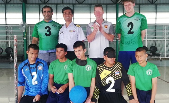 Aussie goalball coach Greg Scott, second right, poses with his players and Thai students from the Pattaya School for the Blind.