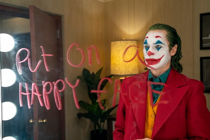 This image released by Warner Bros. Pictures shows Joaquin Phoenix in a scene from the film, “Joker.” (Niko Tavernise/Warner Bros. Pictures via AP)