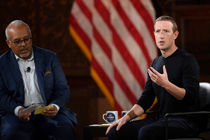 Facebook CEO Mark Zuckerberg speaks at Georgetown University, Thursday, Oct. 17, 2019, in Washington. At left is Mo Elleithee, the founding Executive Director of Georgetown University’s Institute of Politics and Public Service. (AP Photo/Nick Wass)