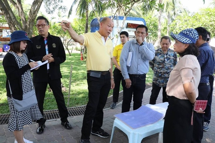 Deputy Mayor Banlue Kullavanijaya has a team survey the area where a future flood mitigation project will be undertaken.