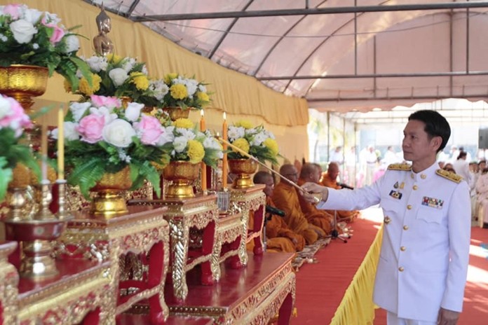 Banglamung District Chief Amnart Charoensri leads religious ceremonies to pay homage to a beloved king on the anniversary of his passing.