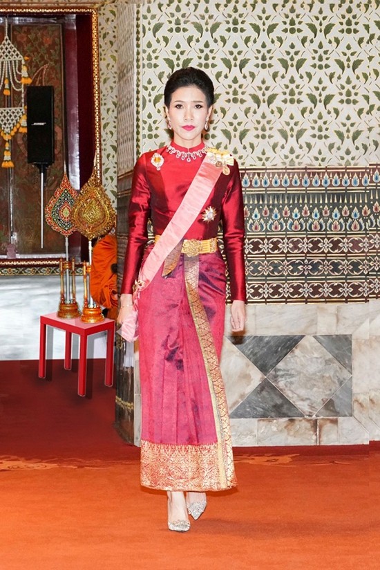 This undated photo posted Monday, Aug. 26, 2019, on the Thailand Royal Office website, shows Major General Sineenatra Wongvajirabhakdi, the royal noble consort of Thailand's King Maha Vajiralongkorn, posing in a royal dress. Late Monday, Oct. 21, 2019, it was announced that HM the King has stripped Sineenatra of her titles and military ranks for disloyalty, accusing her of seeking to undermine the position of his official wife for her own benefit. (Thailand Royal Office via AP)
