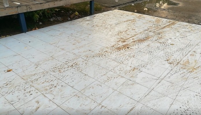Cars driving through the area are leaving a trail of mud and dirt as well as broken tiles across activity zone.