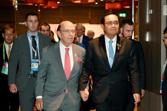 Gen Prayut Chan-o-cha walks hand in hand with U.S. Secretary of Commerce, Wilbur Ross.