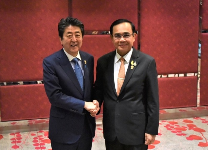 Gen Prayut Chan-o-cha greets Japanese Prime Minister Shinzo Abe.