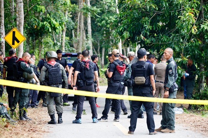 Police secure the road leading to a shooting scene in Yala province, Thailand, Wednesday, Nov. 6, 2019. Gunmen fired at security personnel at checkpoints in Thailand's insurgency-wracked south, killing 15 volunteer officers and wounding five others, police said Wednesday. (AP Photo/Sumeth Panpetch)