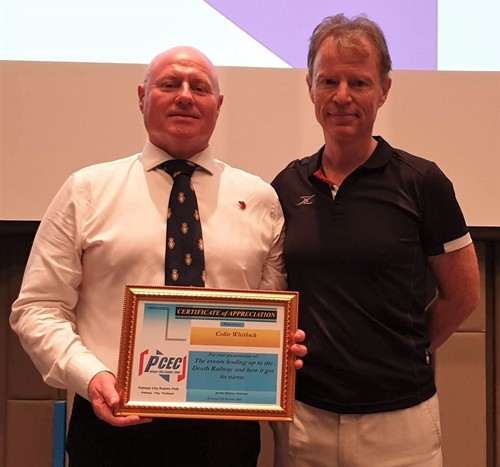 MC Ren Lexander presents the PCEC’s Certificate of Appreciation to Colin Whitlock for his interesting and informative talk about the “Death Railway” along with his reminder that a memorial service will be held in Kanchanaburi as it is every November.