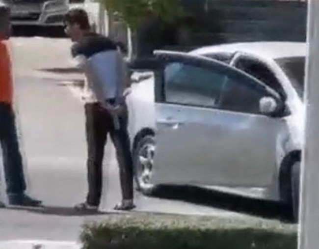 Pol. Col. Thanapong Photi said police are trying to track down a man captured on video threatening a tourist-van driver at gunpoint.