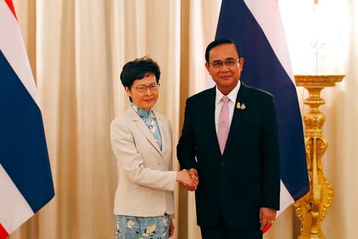 Hong Kong Chief Executive Carrie Lam, left, meets Thailand's Prime Minister Prayuth Chan-ocha at the government house in Bangkok, Thailand Friday, Nov. 29, 2019. (Jorge Silva/Pool Photo via AP)
