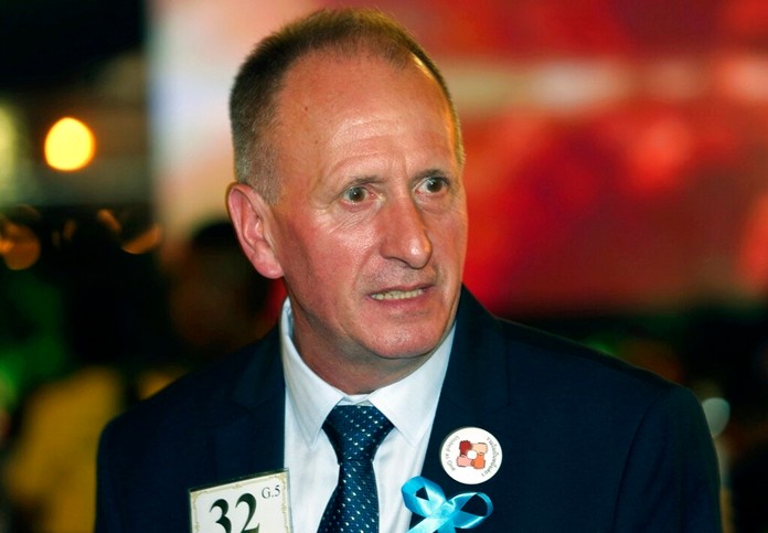 British cave expert Vernon Unsworth talks with guests at an event titled the "United as One" in Bangkok, Thailand Sept. 6, 2018. (AP Photo/Sakchai Lalit, File)