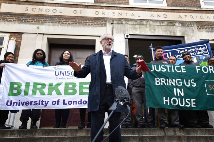Labour leader Jeremy Corbyn speaks outside Birkbeck/SOAS University of London, as he announces his party's plan for the extension of workers' rights, whilst on the General Election campaign trail, in London, Tuesday, Dec.3, 2019. Britain goes to the polls on Dec. 12. (David Mirzoeff/PA via AP)