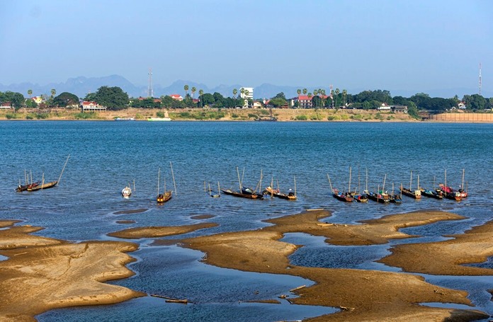 Fishing boats are moored in Mekong River, which has turned blue instead of its usual muddy color, in Nakhon Phanom province, northeastern Thailand Wednesday, Dec. 4, 2019. (AP Photo/Chessadaporn Buasai)