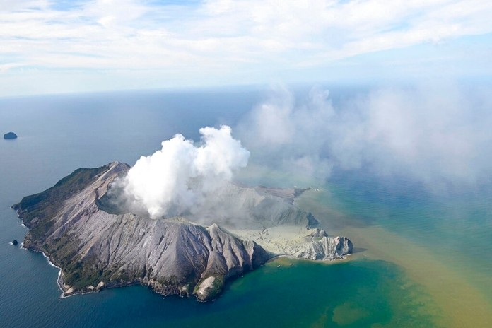 This aerial photo shows White Island after its volcanic eruption in New Zealand Monday, Dec. 9, 2019. (George Novak/New Zealand Herald via AP)