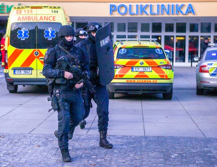 Police personnel outside the Ostrava Teaching Hospital after a shooting incident in Ostrava, Czech Republic, Tuesday, Dec. 10, 2019. (Vladimir Prycek/CTK via AP)
