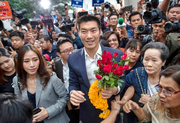 In this Nov. 20, 2019, file photo, Thanathorn Juangroongruangkit, center, leader of the anti-military Future Forward Party is surrounded by his supporters on his arrival at Constitutional Court in Bangkok, Thailand. (AP Photo/Gemunu Amarasinghe, File)