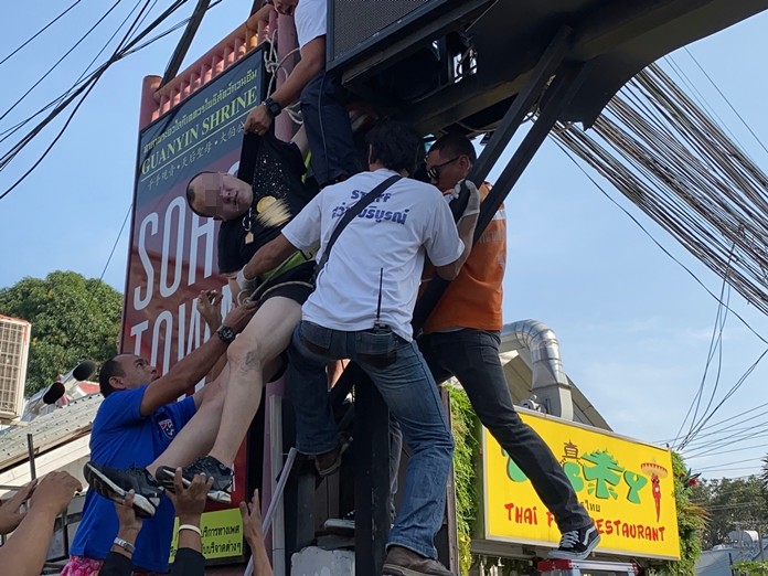 Rescue workers lower Liu Zhanlin to the ground where they provided CPR before sending him to the hospital.