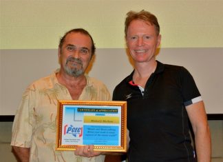 Ren Lexander presents Micheal J. MacIsaac with the PCEC's Certificate of Appreciation for his presentation on his life of creativity and his Age of Awakening Foundation.