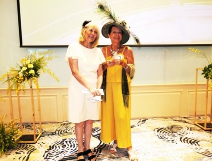 Winner for the most beautiful outfit was Heidi Glemeau, who received her prize from PILC president Sue.