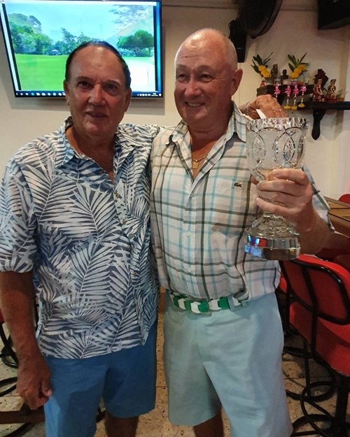 Club Champion Robby Watts receives the trophy from Jimmy Carr.