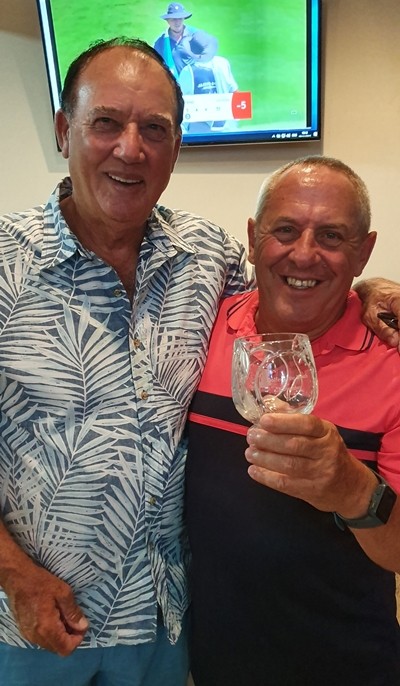 Keith Norman receives golfer of the month trophy from Jimmy Carr.