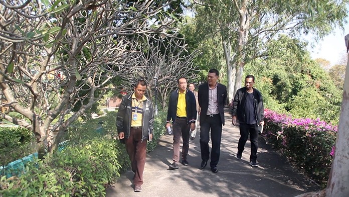 Deputy City Manager Pramote Tubtim, lawyers and engineers tour the five-rai Wang Sam Sien site on Phra Khao Yai.