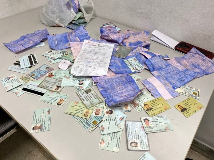A cache of expired identification cards and old traffic tickets were found in a Nong Plalai jungle.