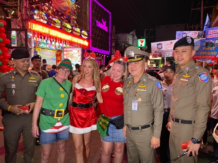 Tourist Police officers handed out chocolates to tourists as they kept watch over Walking Street on Christmas night.
