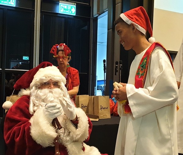 Even the older children enjoyed meeting Santa as this young lad shows with the smile on his face.