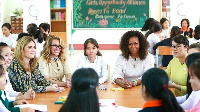 Former U.S. fist lady Michelle Obama, actress Julia Roberts, fifth left, and Jenna Bush Hager, fourth left, talk with female students at the Can Giuoc high school in Long An province, Vietnam on Monday, Dec. 9, 2019. Mrs. Obama is on a trip to Vietnam to promote education for adolescent girls. (AP Photo/Hau Dinh)