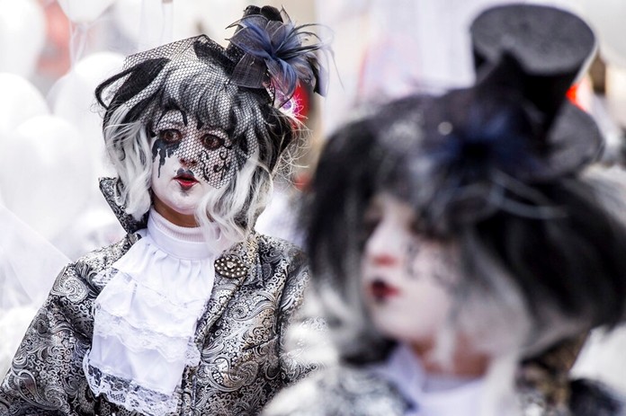 In this Sunday, Feb. 10, 2013 file photo, people celebrate carnival during the yearly procession in Aalst, Belgium. (AP Photo/Geert Vanden Wijngaert, File)