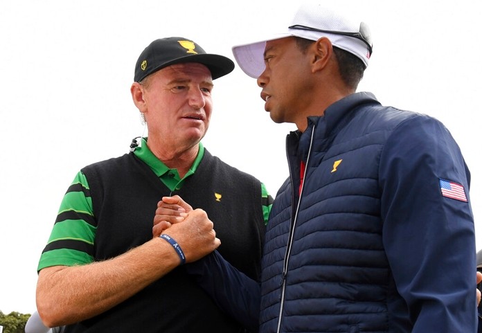 International team captain Ernie Els, left, shakes hands with U.S. team player and captain Tiger Woods after the U.S. team won the President's Cup golf tournament at Royal Melbourne Golf Club in Melbourne, Sunday, Dec. 15, 2019. The U.S. team won the tournament 16-14. (AP Photo/Andy Brownbill)