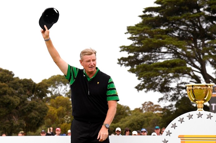 International team captain Ernie Els raises his hat during the presentation ceremony after the U.S. team won the President's Cup golf tournament at Royal Melbourne Golf Club in Melbourne, Sunday, Dec. 15, 2019. The U.S. team won the tournament 16-14. (AP Photo/Andy Brownbill)