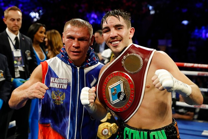 Ireland's Michael Conlan, right, poses with Russia's Vladimir Nikitin after a WBO intercontinental featherweight boxing match, Saturday, Dec. 14, 2019, in New York. Conlan defeated Nikitin by unanimous decision. (AP Photo/Michael Owens)