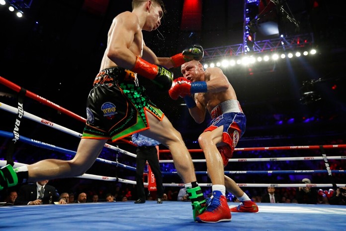 Ireland's Michael Conlan, left, and Russia's Vladimir Nikitin fight during the eighth round of a WBO intercontinental featherweight boxing match, Saturday, Dec. 14, 2019, in New York. (AP Photo/Michael Owens)