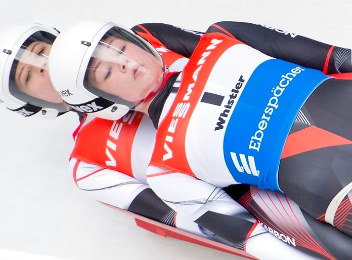 Caitlin Nash and Natalie Corless, of Canada, are seen during the first run of doubles luge during the Viessmann Luge World Cup in Whistler, British Columbia, Saturday, Dec. 14, 2019. (Jonathan Hayward/The Canadian Press via AP)