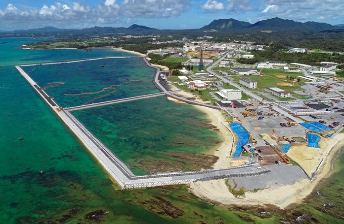 This Aug. 2018, file aerial photo shows preliminary construction work off Henoko, in Nago city, Okinawa prefecture, Japan, where the Japanese government plans to relocate a U.S. air base from one area of Okinawa's main island to another.(Koji Harada/Kyodo News via AP, File)