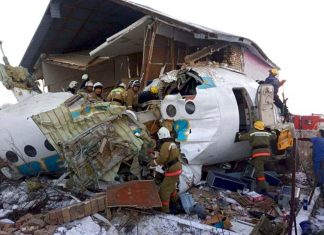 Police and rescuers work on the site of a plane crash near Almaty International Airport, outside Almaty, Kazakhstan, Friday, Dec. 27, 2019. (Emergency Situations Ministry of the Republic of Kazakhstan photo via AP)