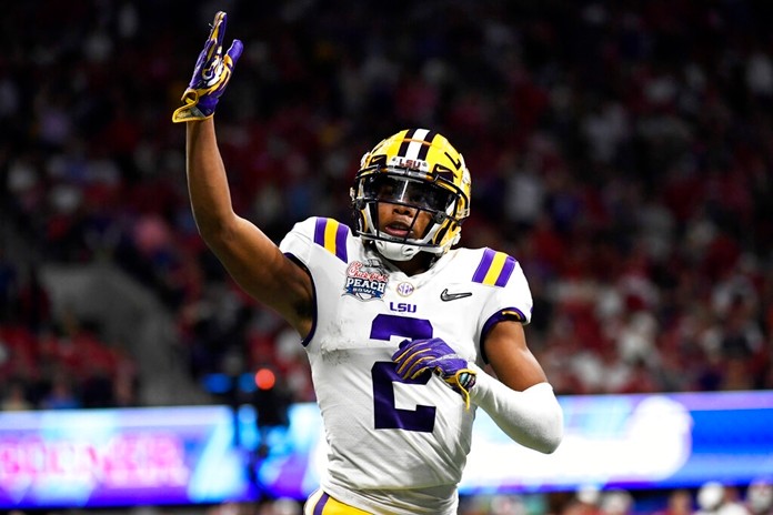 LSU wide receiver Justin Jefferson (2) celebrates his touchdown against Oklahoma during the first half of the Peach Bowl NCAA semifinal college football playoff game, Saturday, Dec. 28, 2019, in Atlanta. LSU won 63-28. (AP Photo/Danny Karnik)