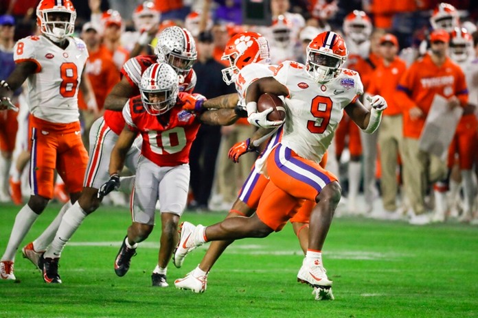 Clemson running back Travis Etienne runs for a touchdown against Ohio State during the second half of the Fiesta Bowl NCAA college football playoff semifinal Saturday, Dec. 28, 2019, in Glendale, Ariz. (AP Photo/Rick Scuteri)