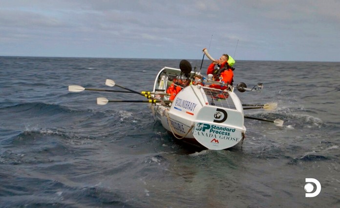 This image released by Discovery Channel shows Icelandic ocean rower Fiann Paul blowing a horn in a scene from “The Impossible Row," documenting endurance athlete Colin O’Brady and his crew's crossing of the treacherous icy waters of The Drake Passage by row boat. (Discovery Channel via AP)
