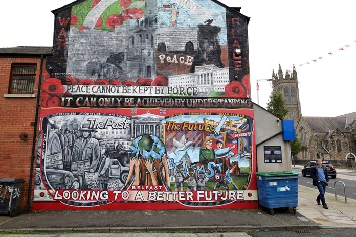 In this Tuesday, Oct. 15, 2019 file photo showing a Loyalist mural painted on a wall in east Belfast, Northern Ireland.(AP Photo/Peter Morrison, File)